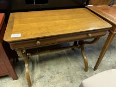 X frame mahogany veneer side table.