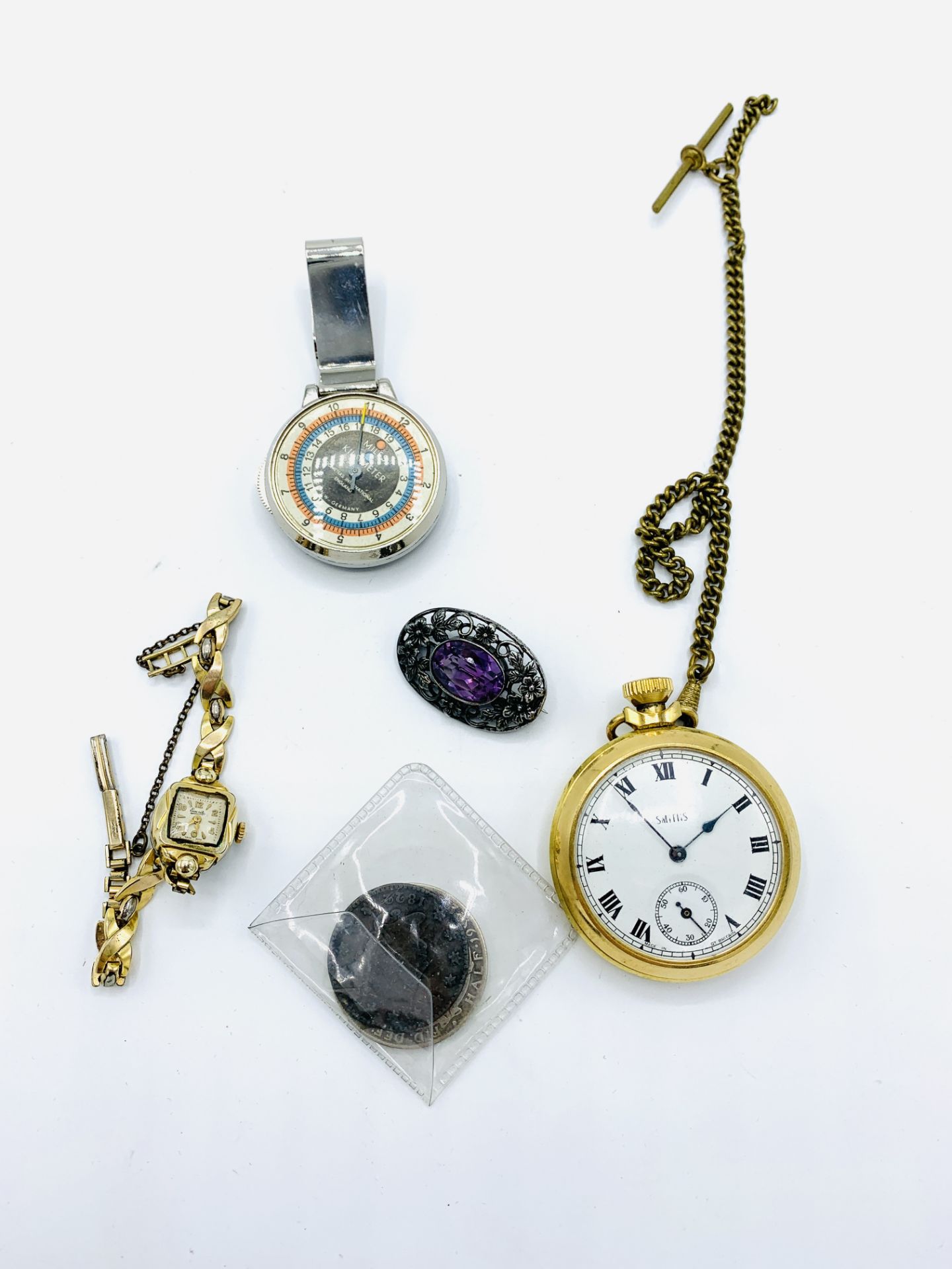 Everite lady's wrist watch; Smiths pocket watch; pedometer; brooch and two coins.