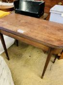 Mahogany gate leg side table with fold over top on tapered legs.