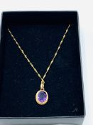 9ct gold amethyst pendant on 9ct gold chain.