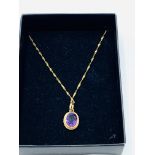 9ct gold amethyst pendant on 9ct gold chain.