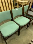 Four G-plan style green upholstered dining chairs.