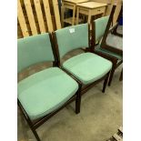 Four G-plan style green upholstered dining chairs.