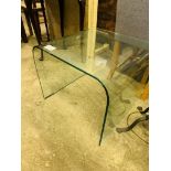 Curved glass display table.