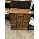 Hardwood chest of nine drawers.