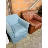Small armchair upholstered in blue loose cover, and a brown leather armchair.
