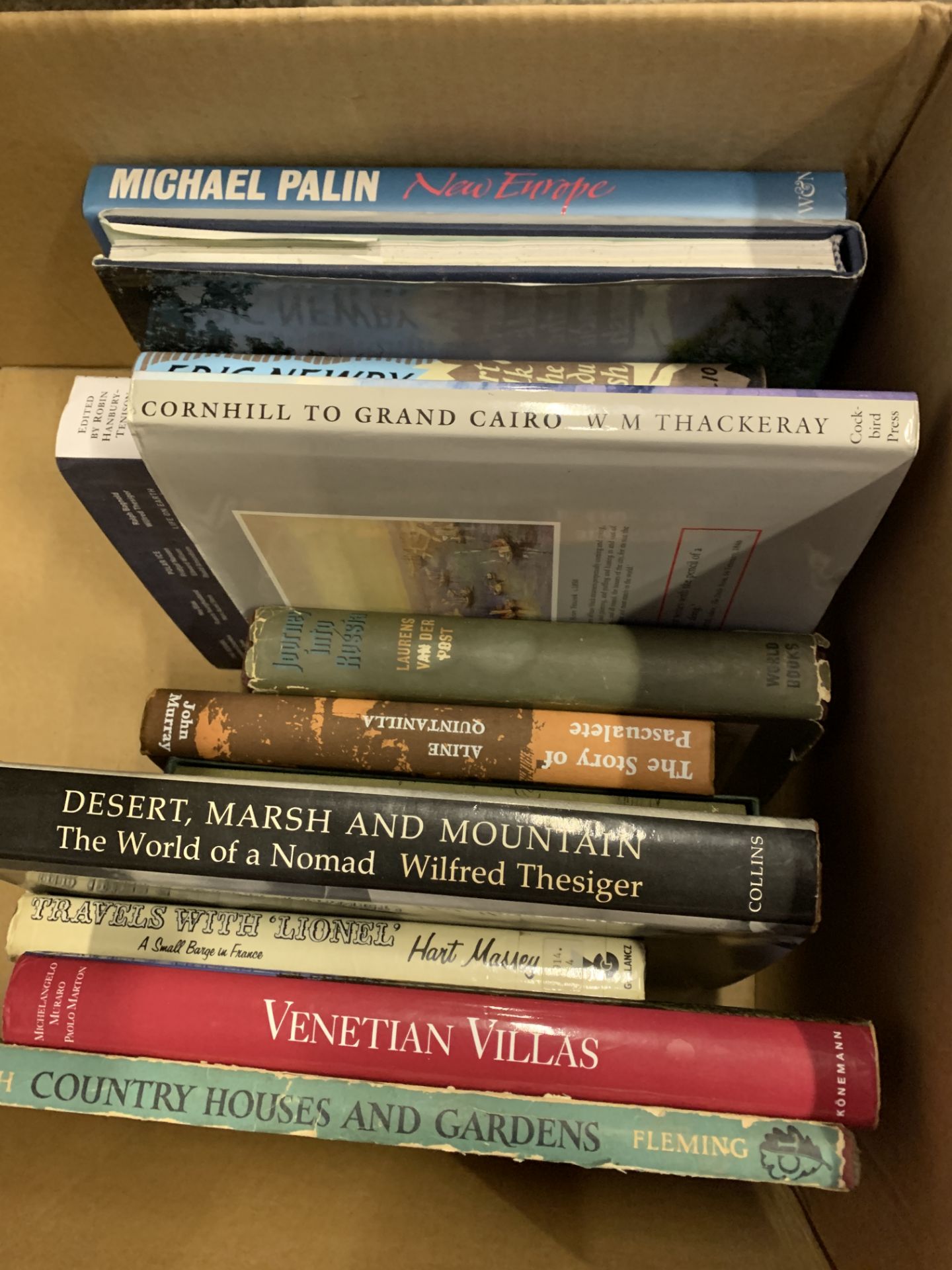 Box of books on travel.