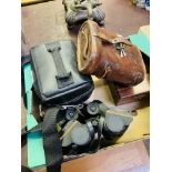 Pair of WW1 binoculars; a pair of WW2 binoculars; and other items.