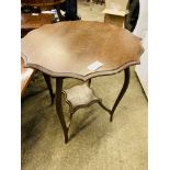 Mahogany display table together with a hardwood coffee table.