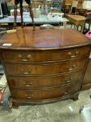 Bow fronted mahogany chest of four graduated drawers.