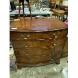 Bow fronted mahogany chest of four graduated drawers.