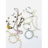 Five freshwater pearl bracelets and necklaces.
