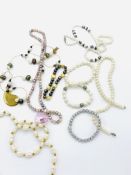 Five freshwater pearl bracelets and necklaces.