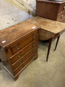 Mahogany chest of four drawers and a mahogany oval drop leaf table.