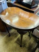 Mahogany kidney shaped occasional table.