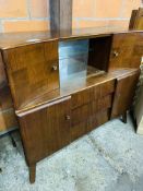 1950's sideboard with glass sliding doors.