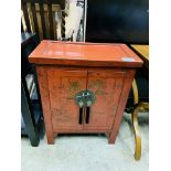 Oriental style cabinet with brass lock and handles.