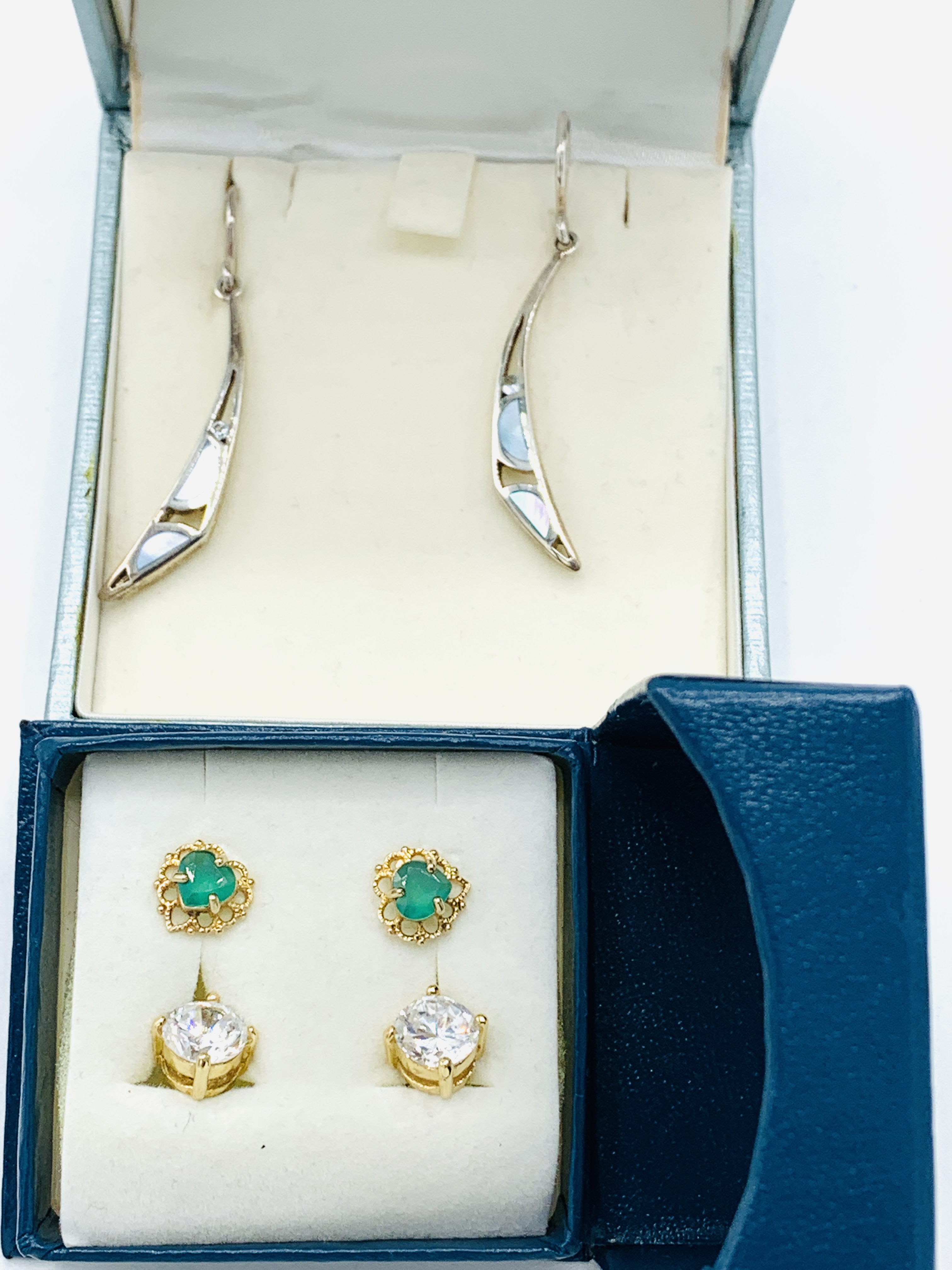 925 silver drop earrings together with two pairs of stud earrings.