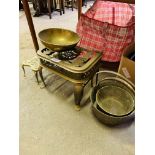 Two brass trivets and brass preserving pans.