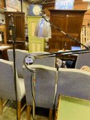 Metal floor-standing reading light, and a chrome floor-standing reading light.