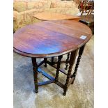 Two oak drop-side tables.