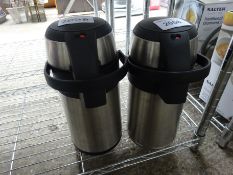 Two vacuum flasks. This item carries VAT.