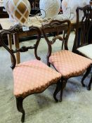 Two Victorian balloon back dining chairs.