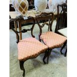 Two Victorian balloon back dining chairs.