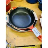 Two Le Creuset frying pans.