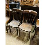 Two elm seat comb back kitchen chairs.