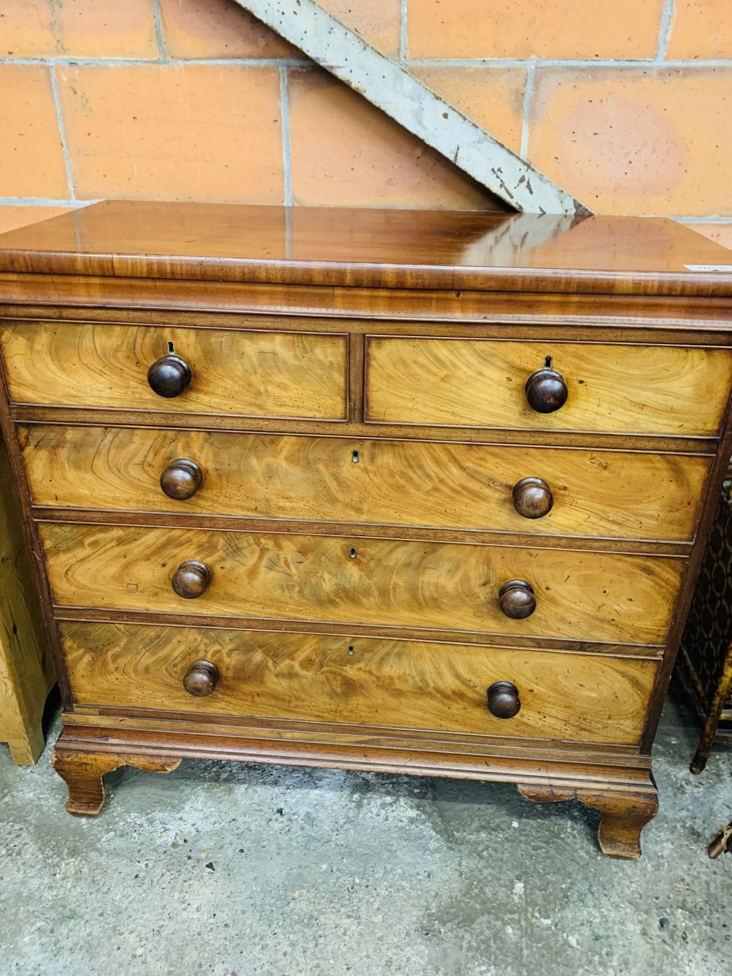 Victorian mahogany chest of two over three graduated drawers with bun handles.