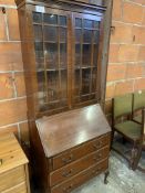 Mahogany glazed bookcase on bureau base size.