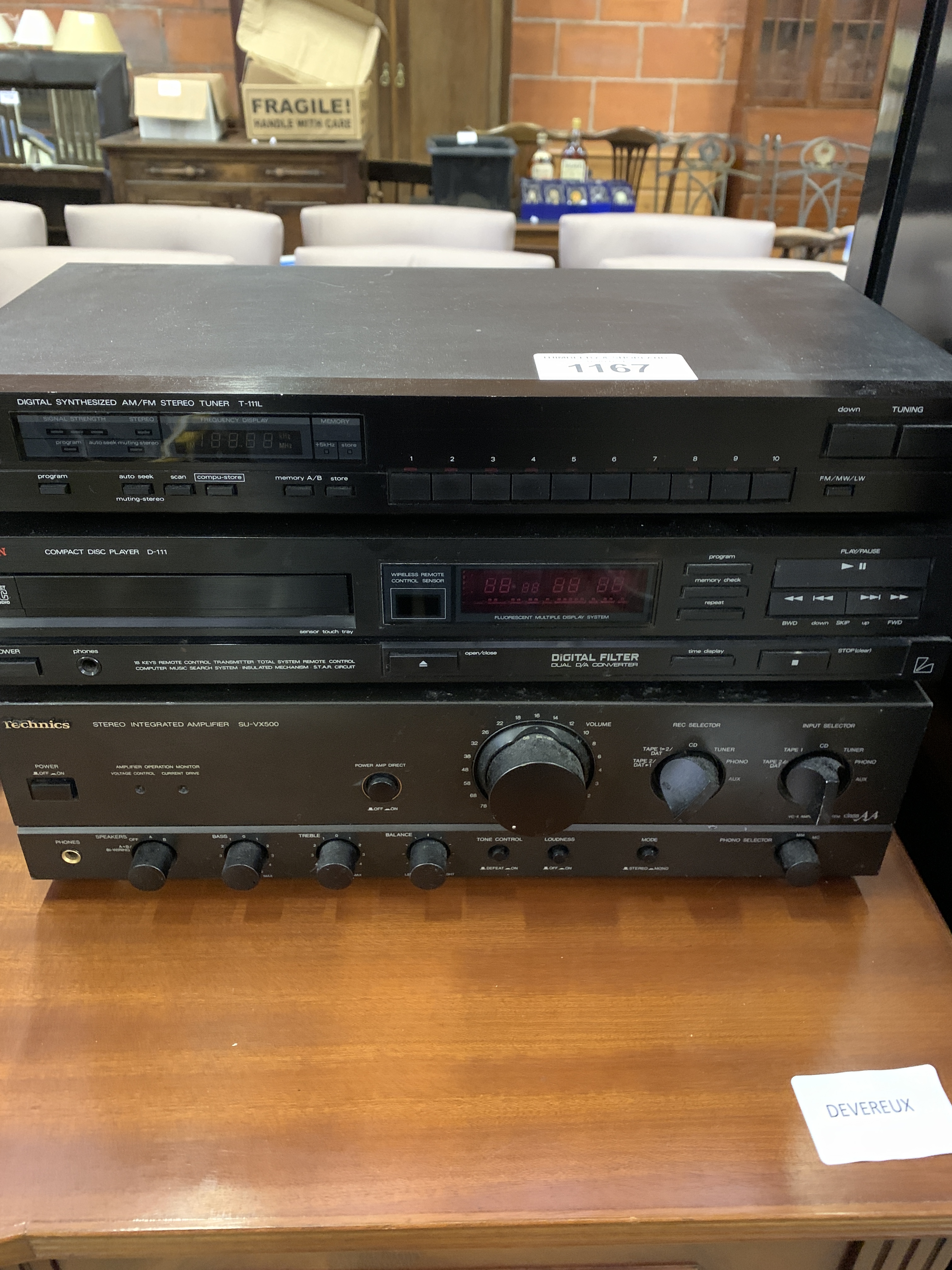 Technics amplifier; Luxman compact disc player, and AM/FM tuner.