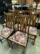 Five oak framed rail back dining chairs, matching carver, and another carver.