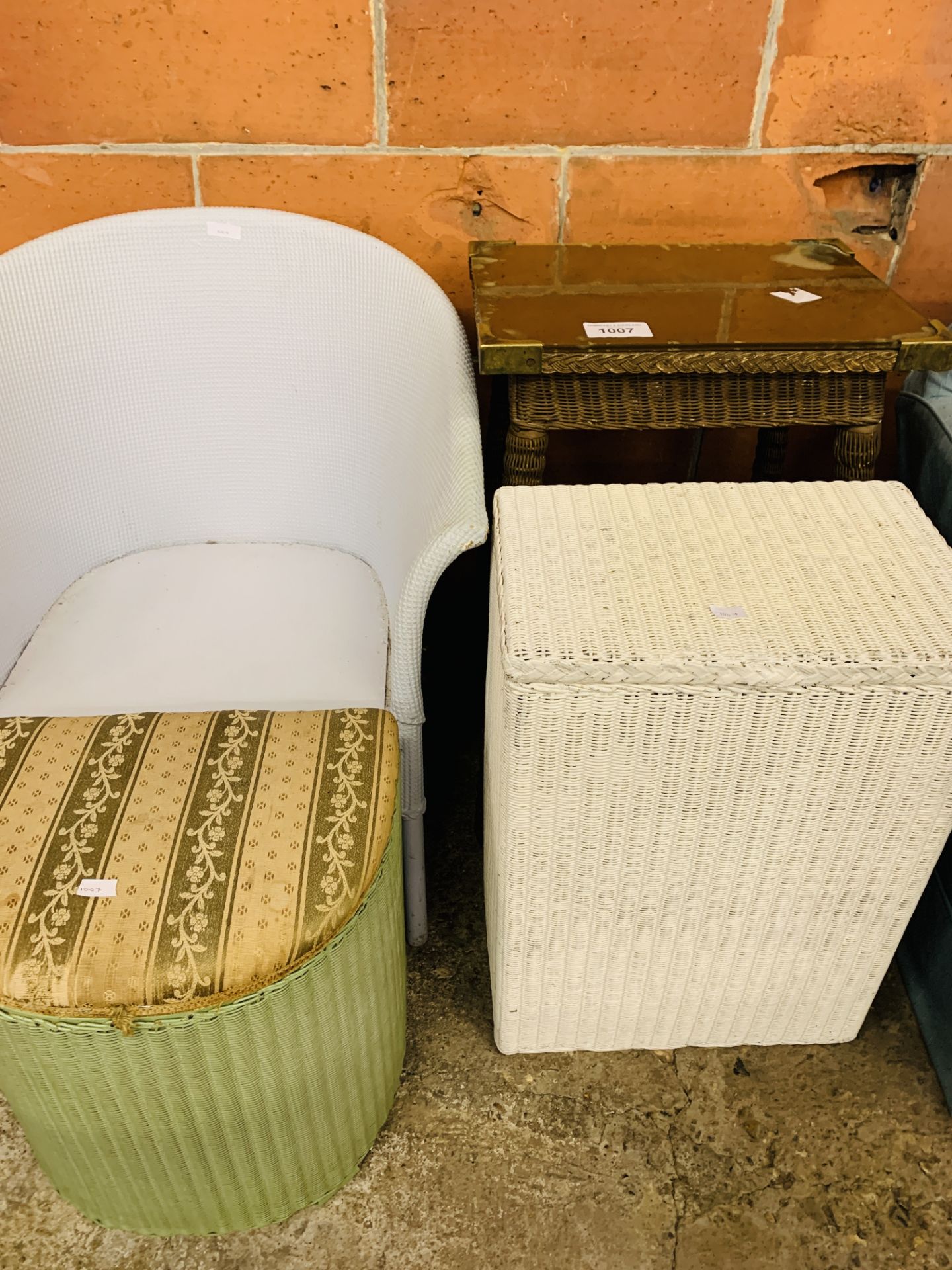 Three items of Lloyd Loom furniture and another similar.