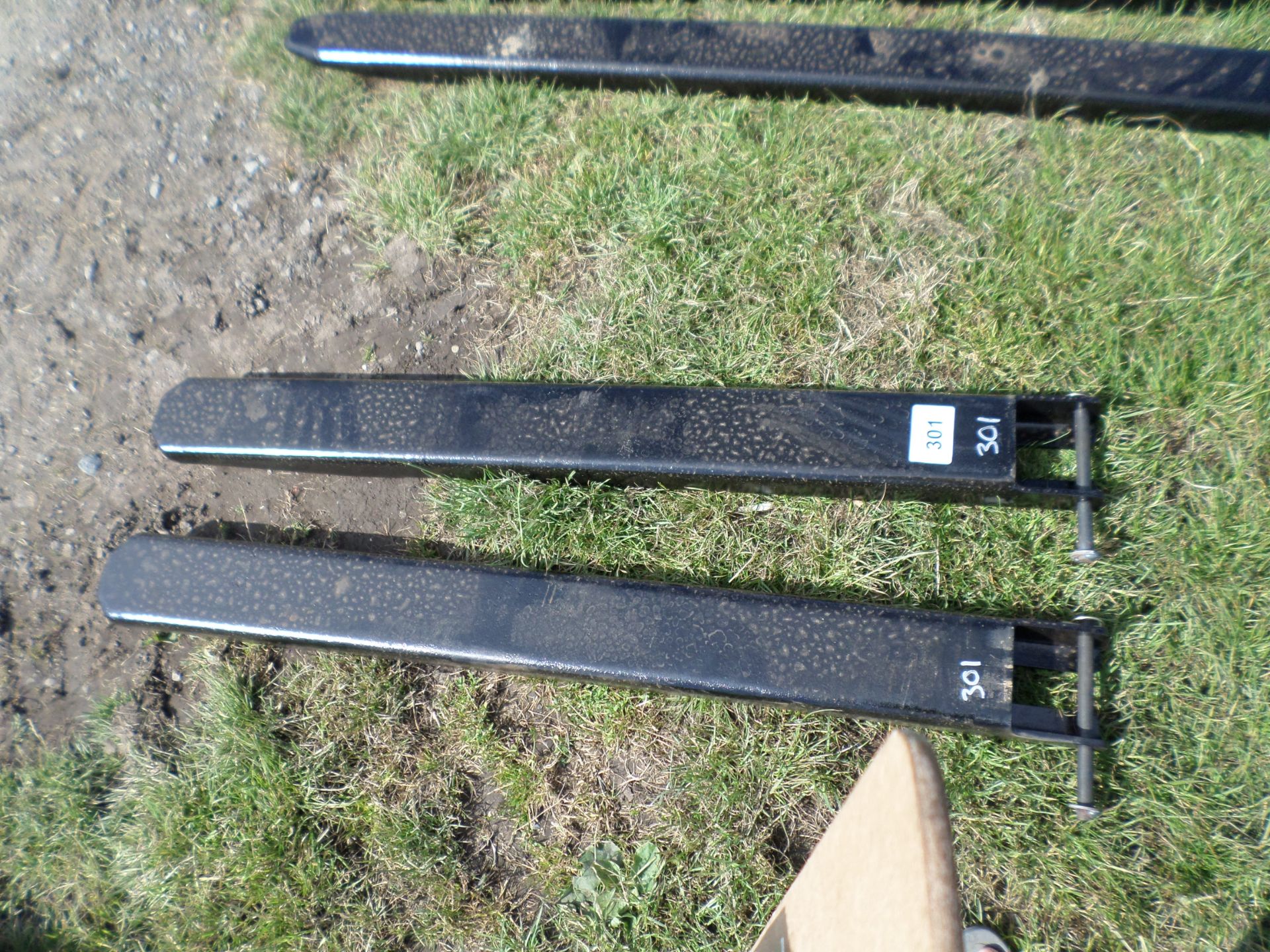 Pair of metal forklift extension tines