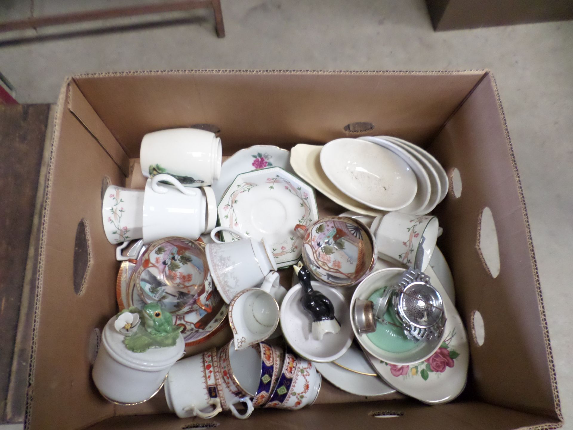2 boxes of ornaments and tableware