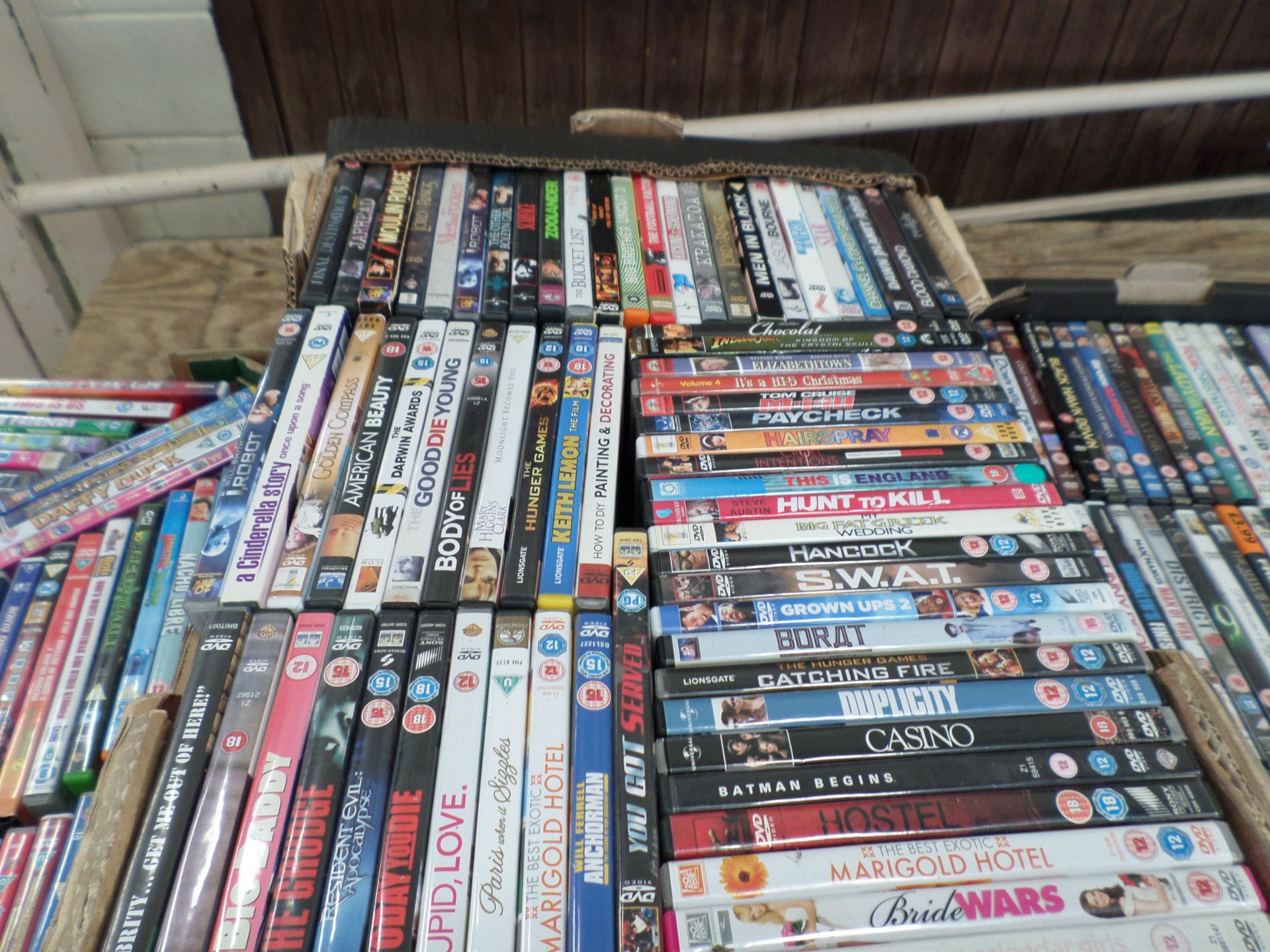 3 boxes of mixed DVDs