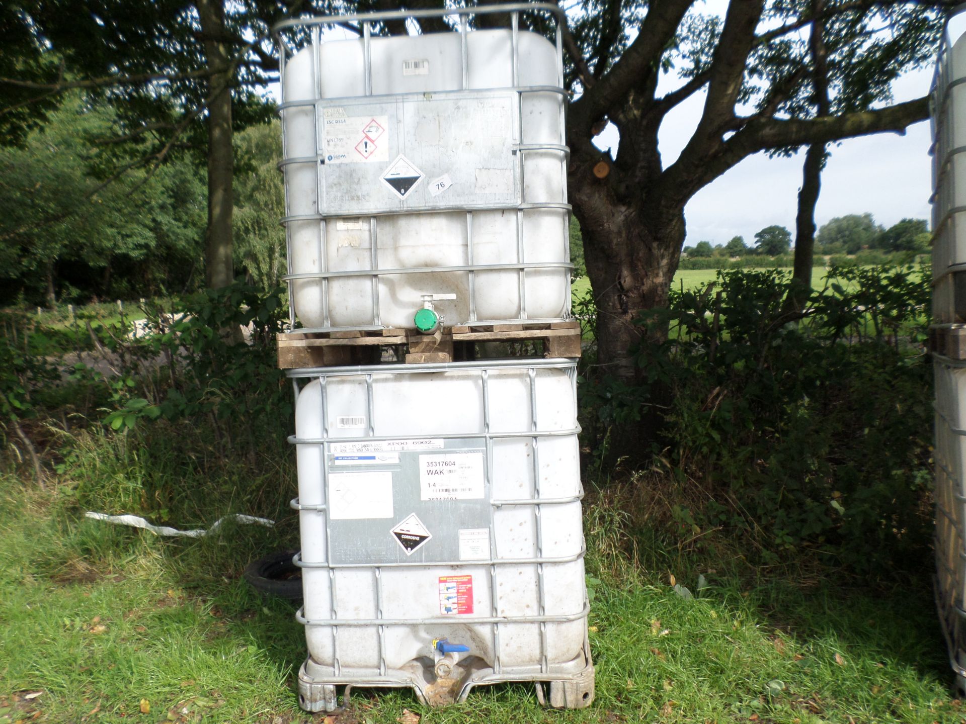 2 x plastic IBCs in metal frame