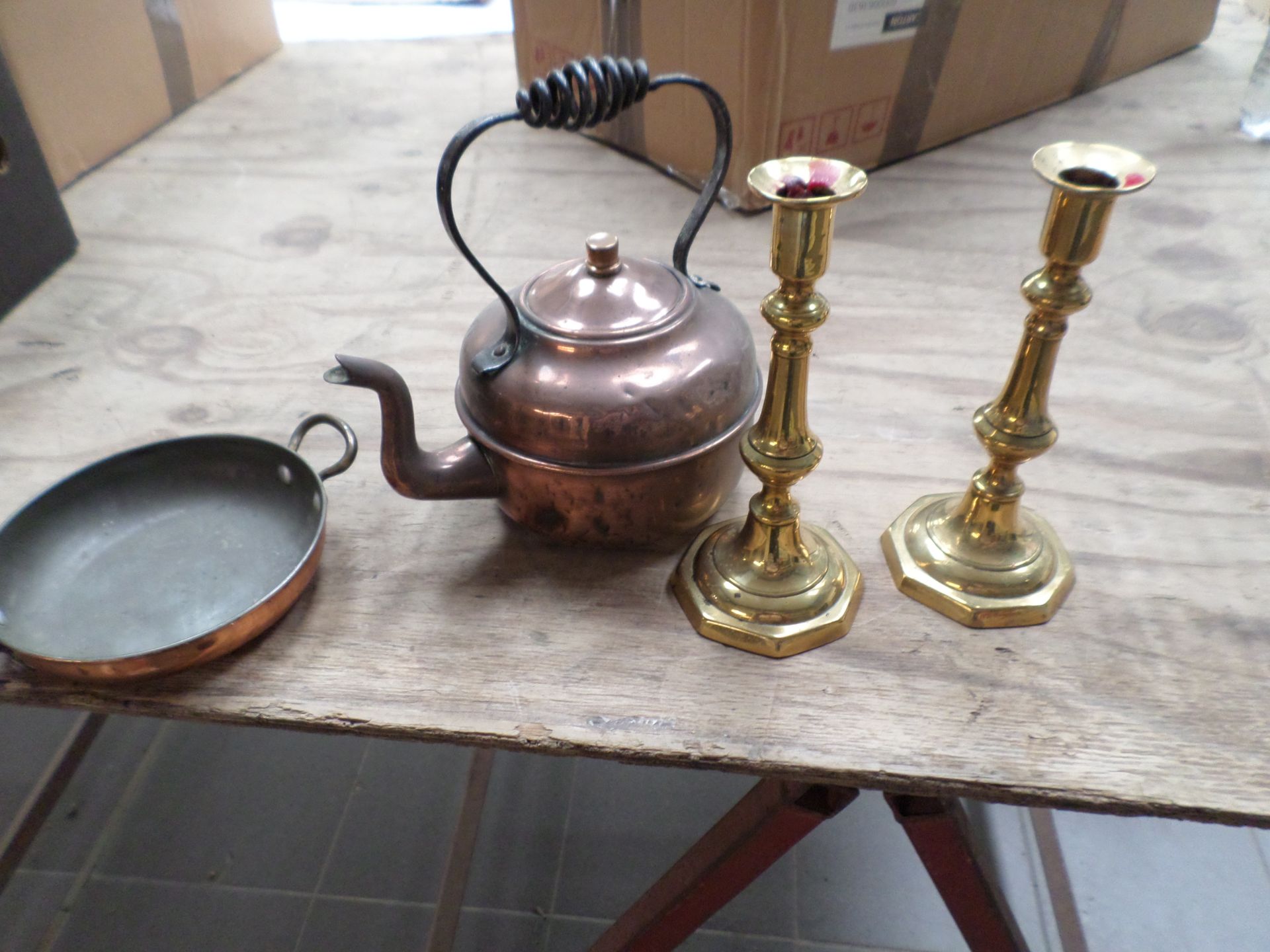 Brass candlesticks, bell, shoes, copper kettle and dish