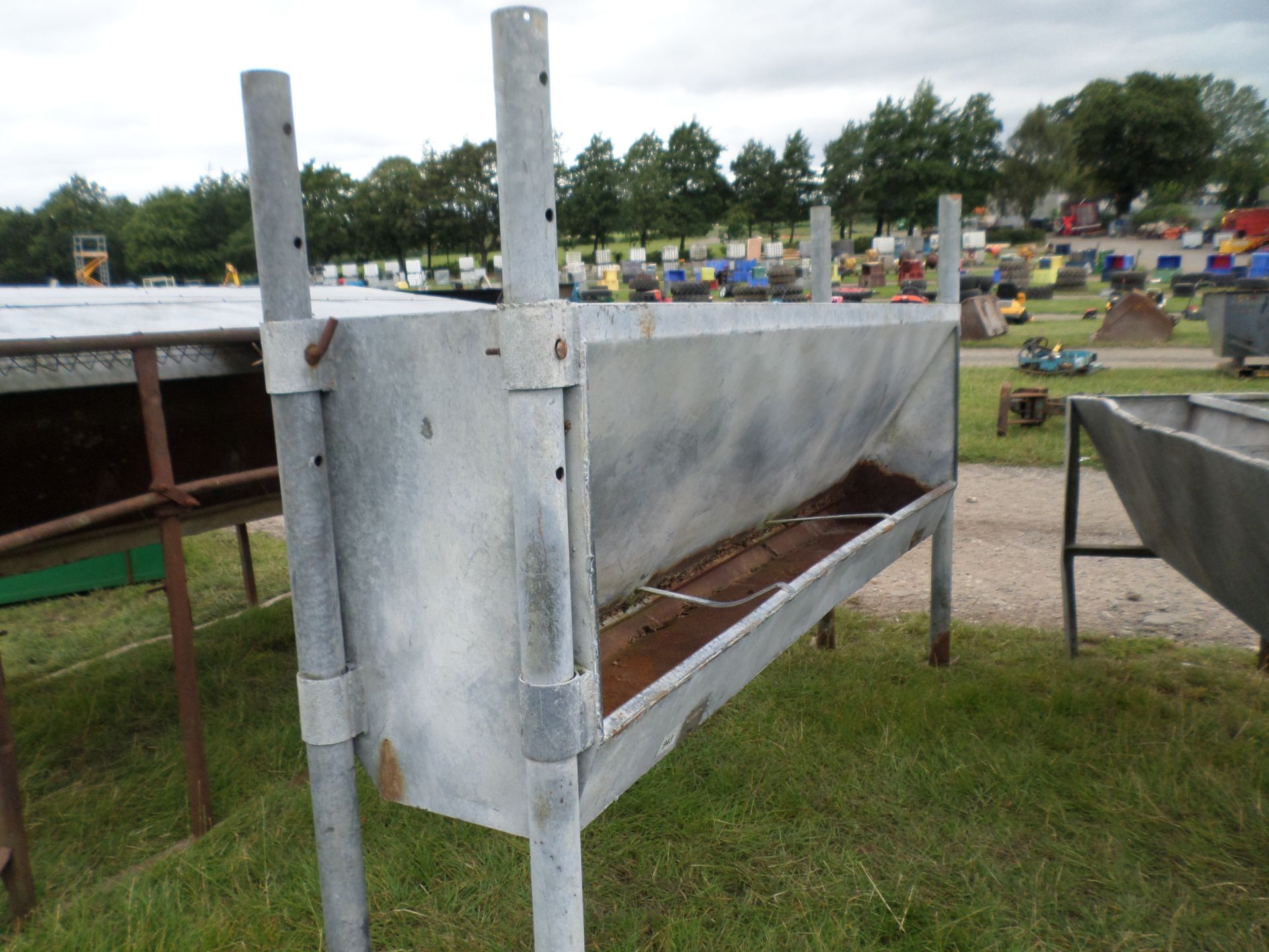 Trough and cattle feed barrier