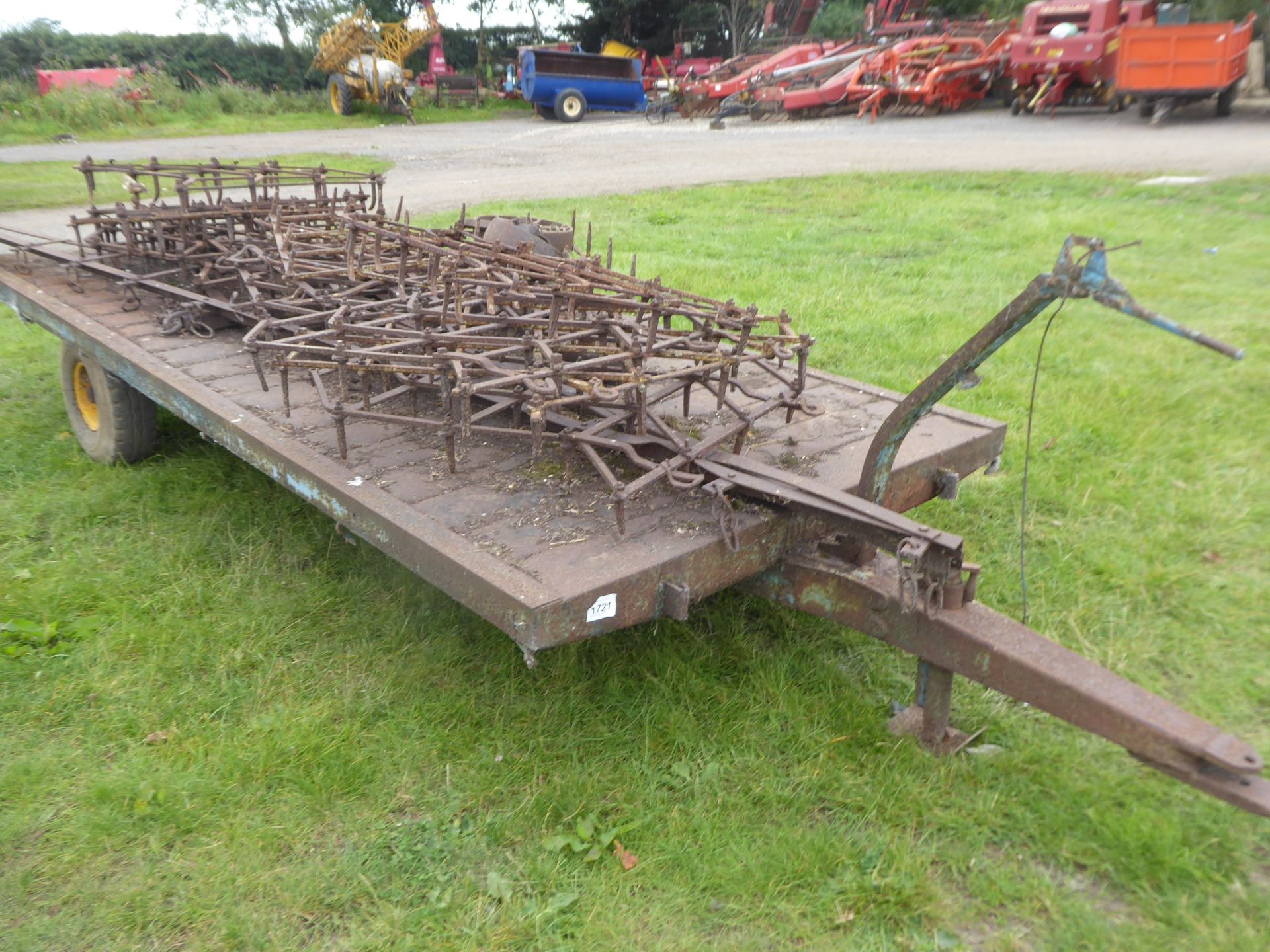 Weeks 15ft flat trailer, single axle with bale gormers and selection of harrows, poor condition