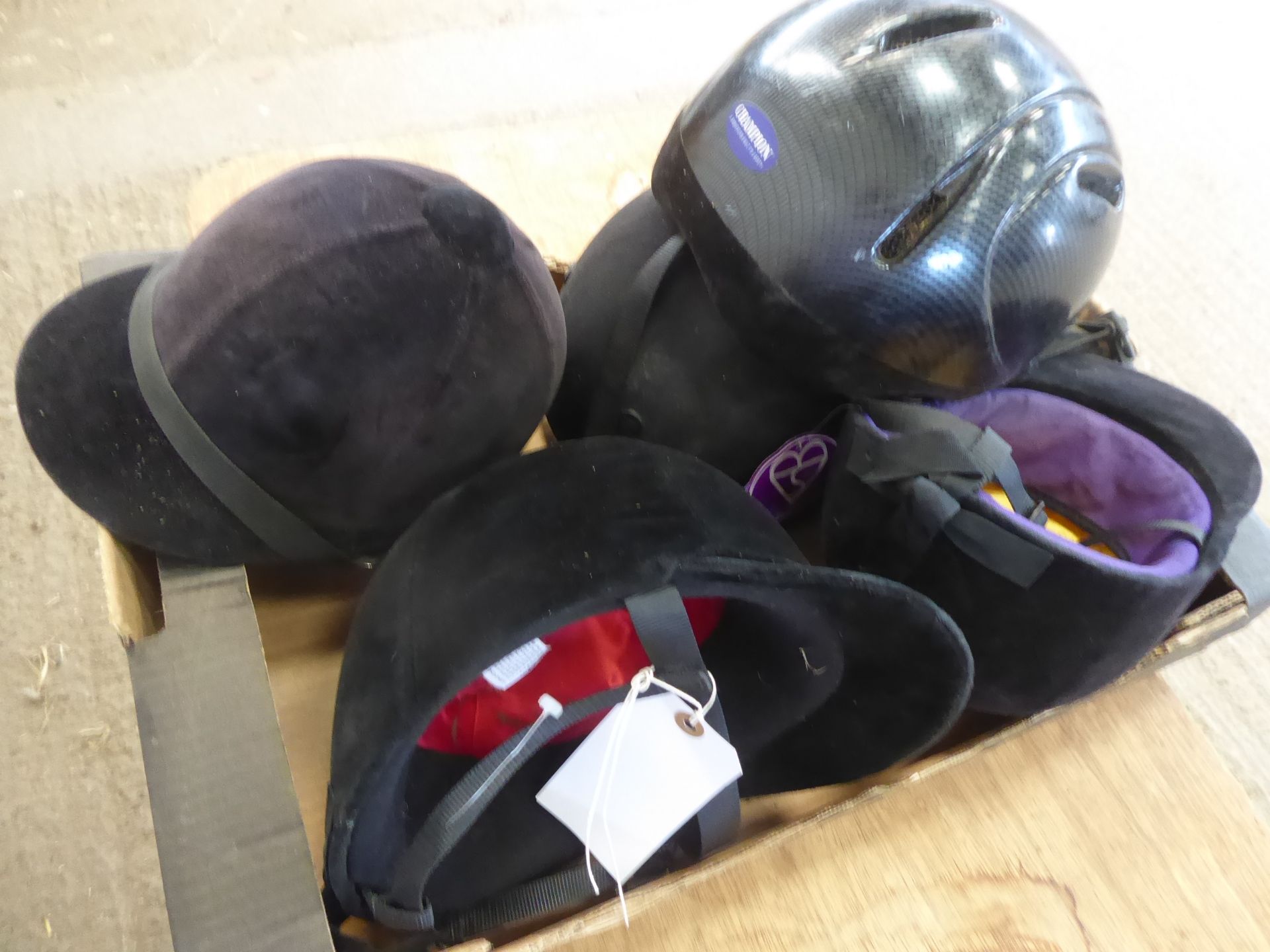 Box of riding hats, various sizes