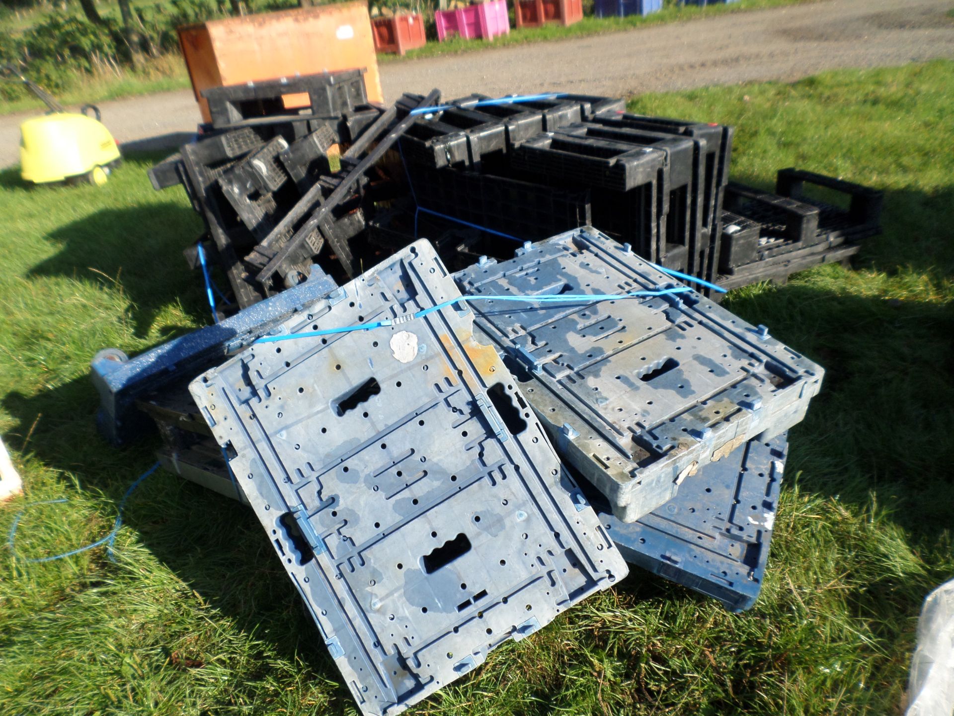 Quantity of plastic pallets on wheels