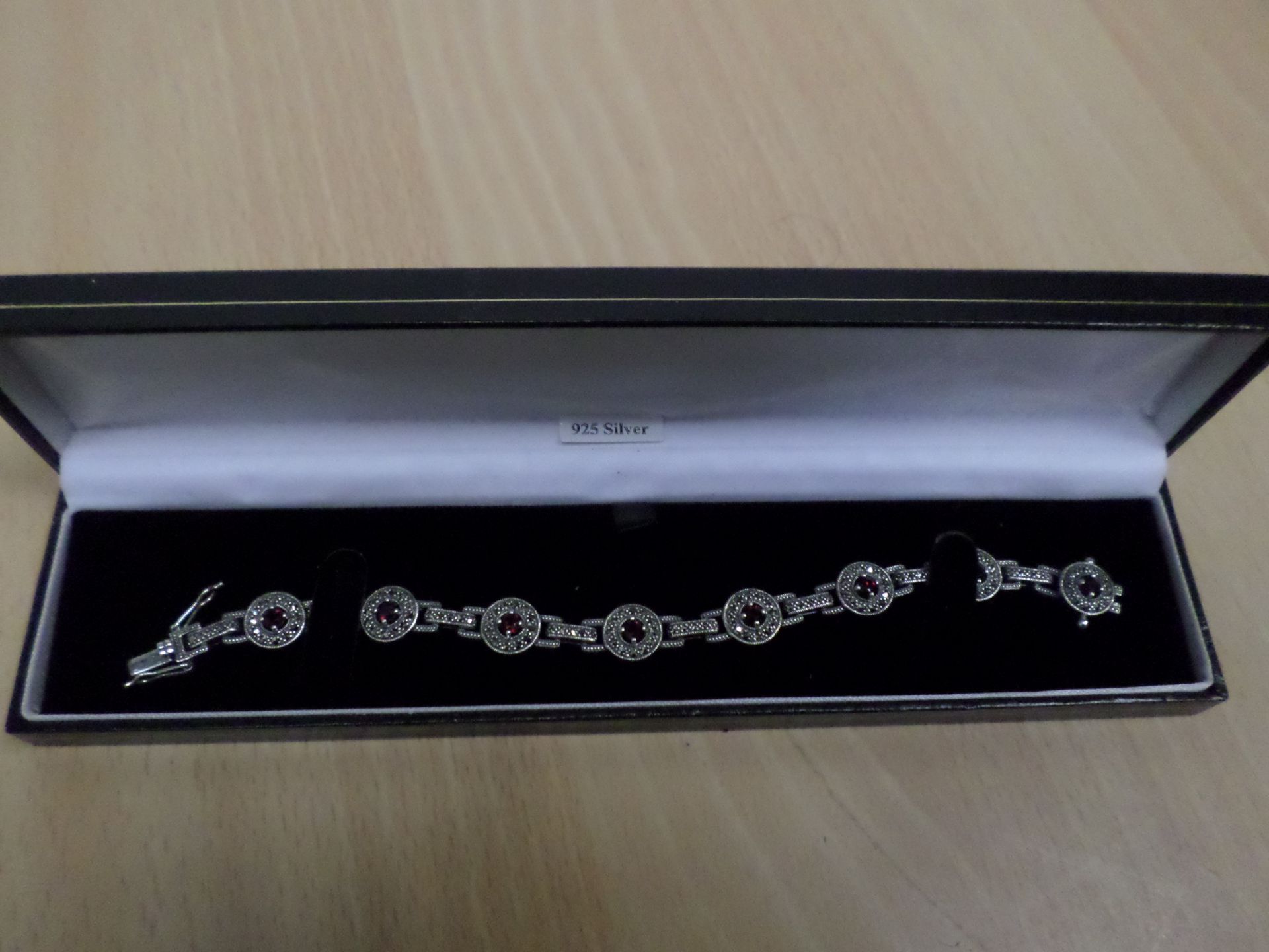 Hallmarked silver garnet and marcasite fancy bracelet