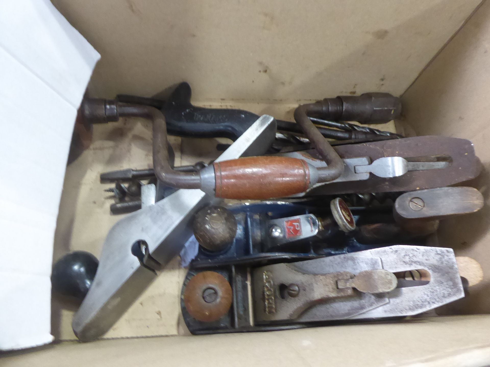 Box of hand planes, hand drills and drill bits