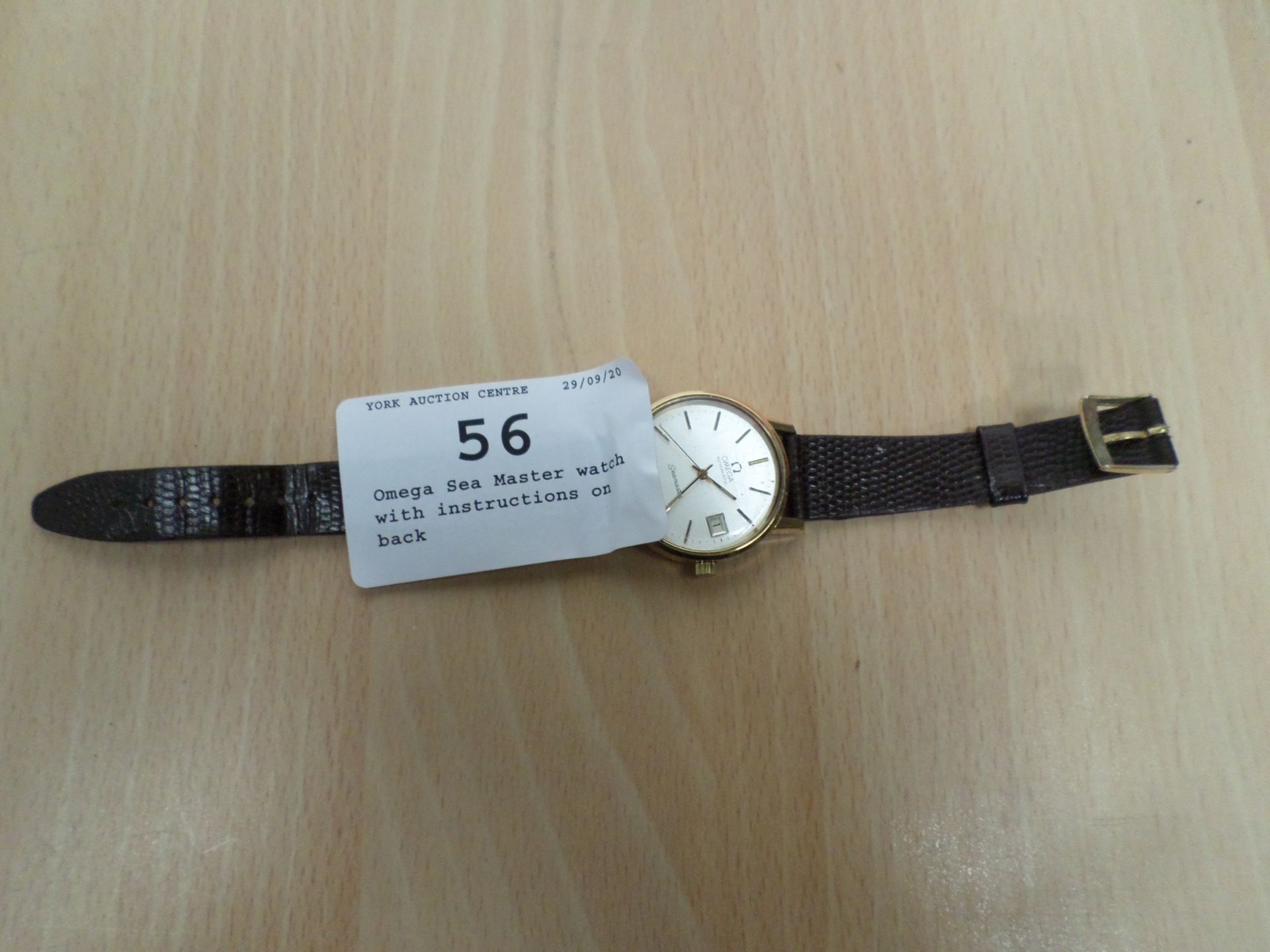 Omega Sea Master watch with instructions on back