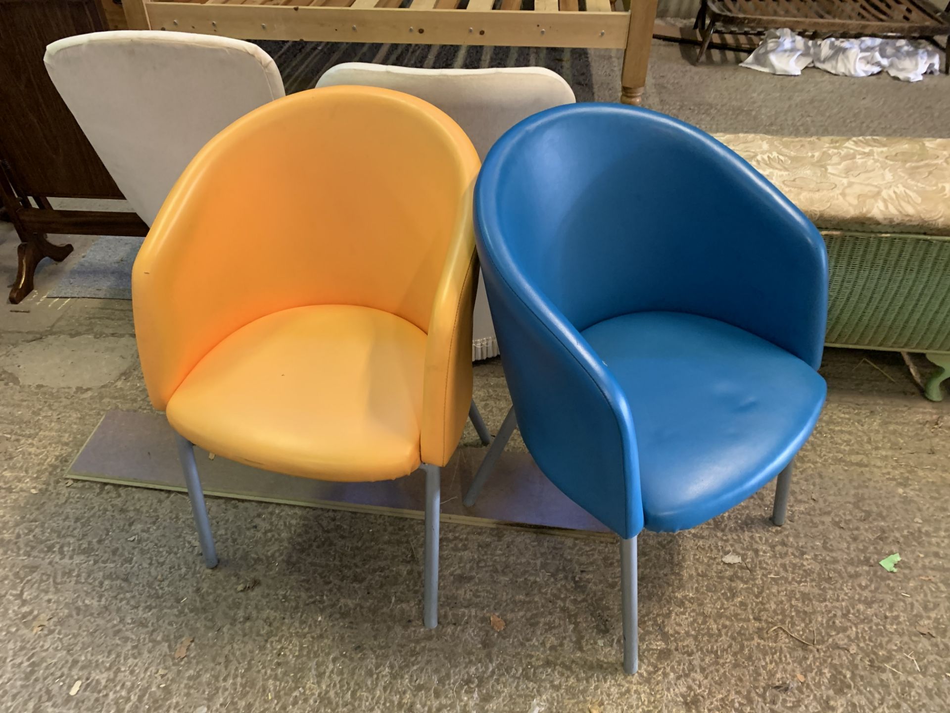 2 yellow and blue tub chairs