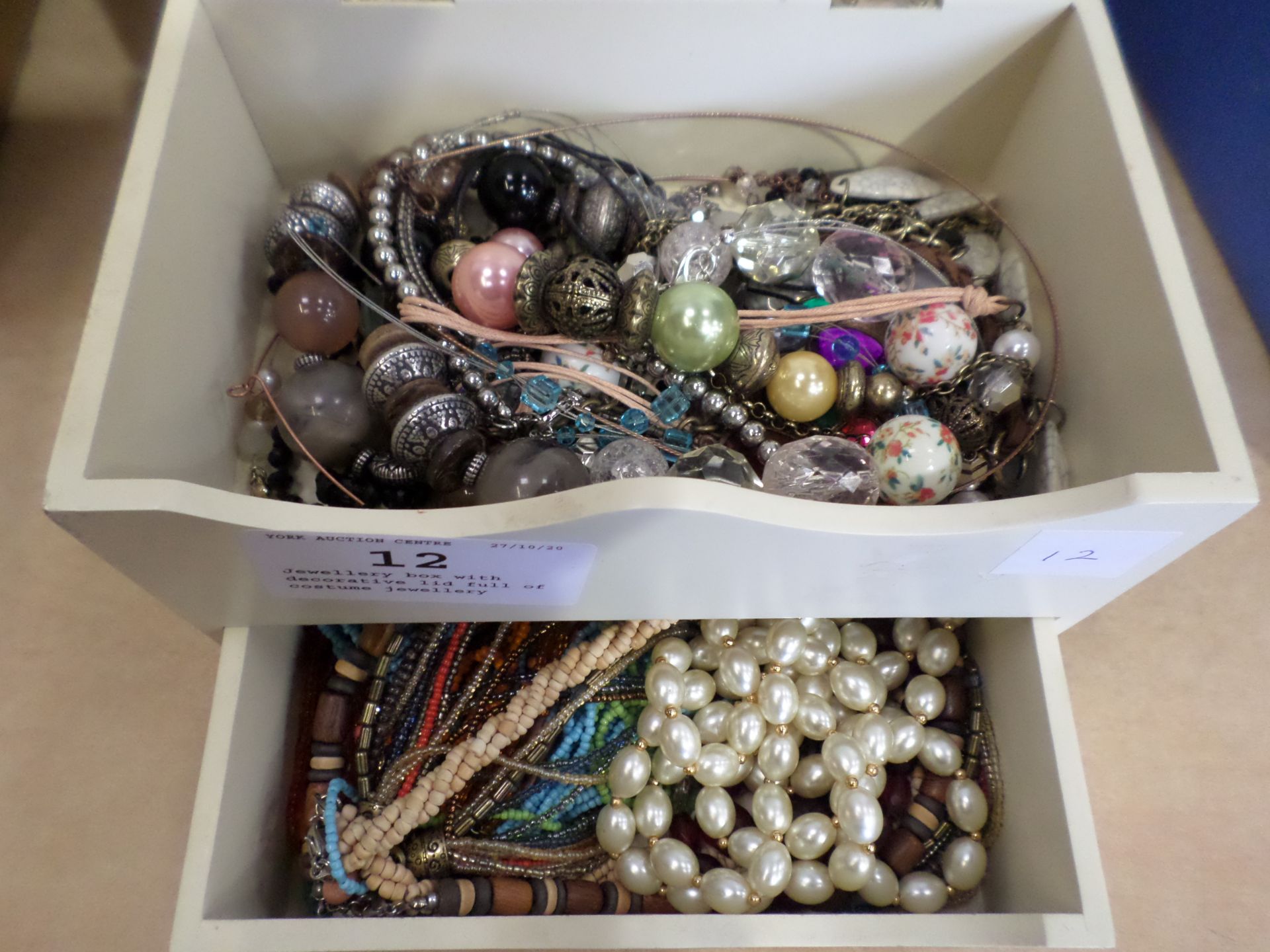Jewellery box with decorative lid full of costume jewellery