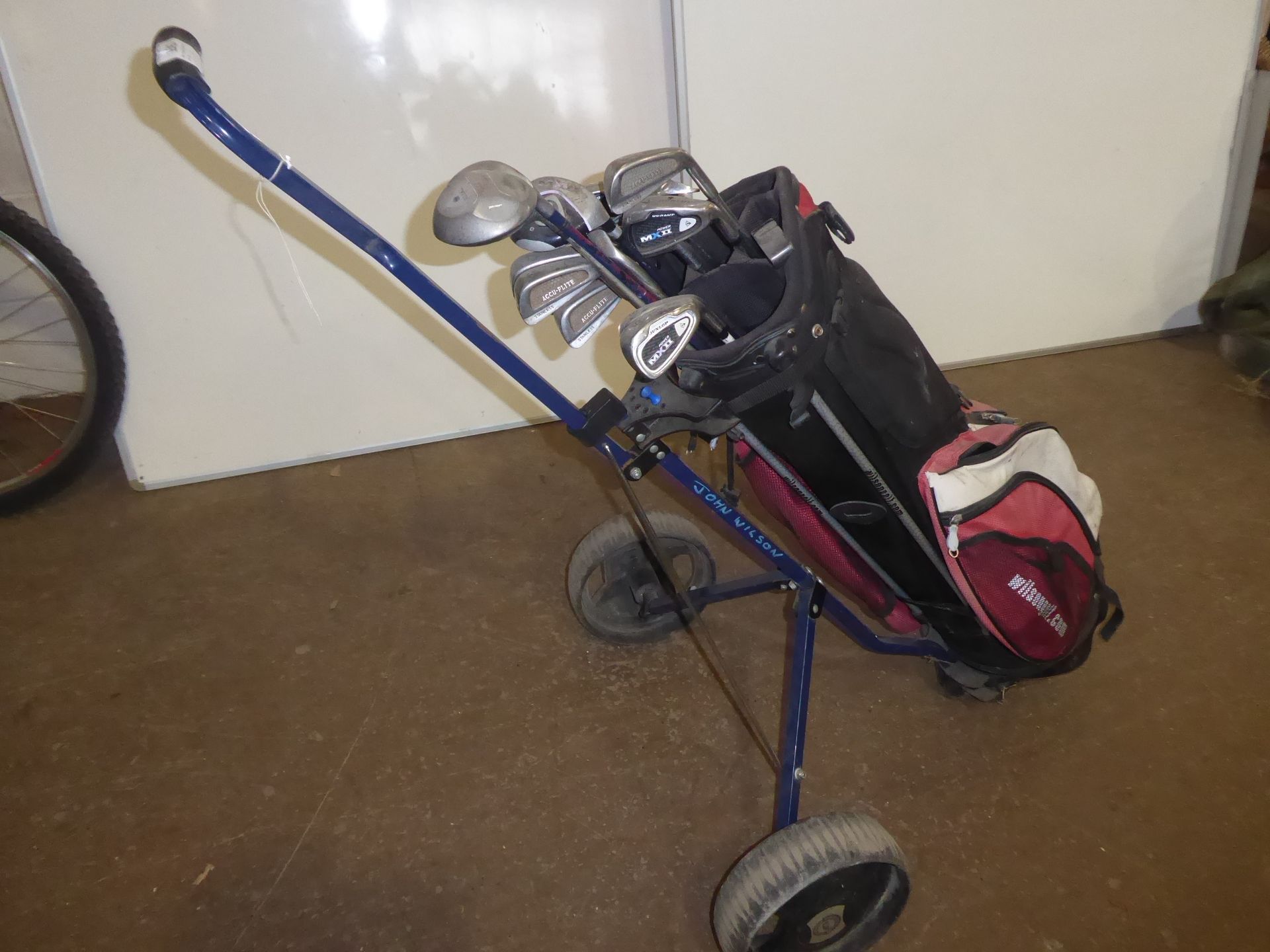 Bag of golf clubs and trolley